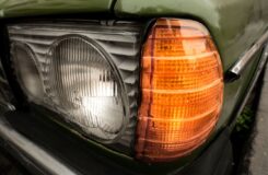 Close-up of a green Mercedes Benz 250 parked on the road