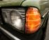 Close-up of a green Mercedes Benz 250 parked on the road